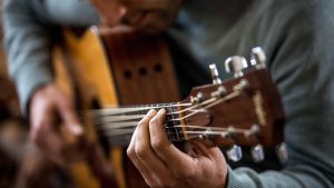 Man playing acoustic guitar - live music at the Drovers Inn Loch Lomond